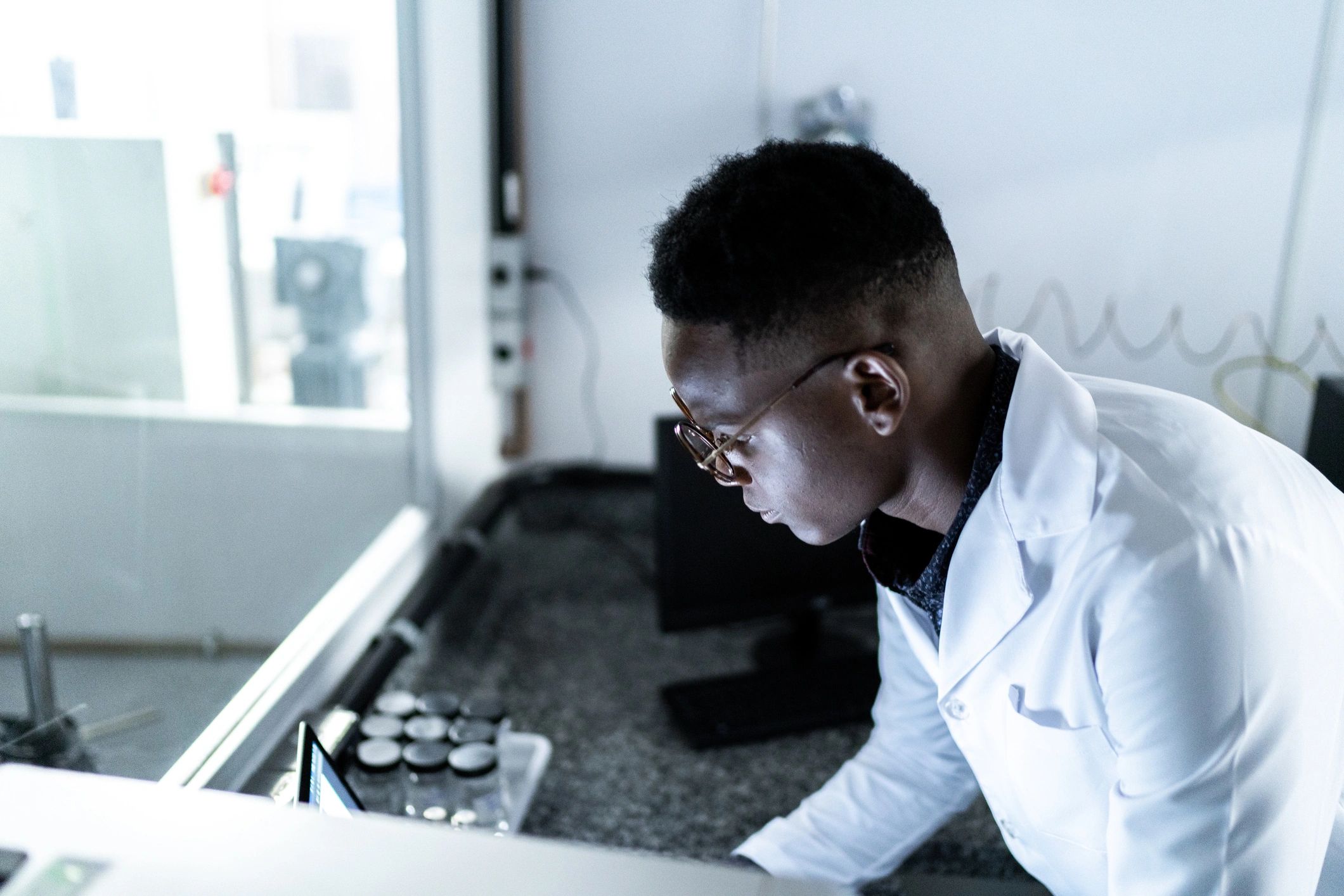 Scientist using a computer in a laboratory setting