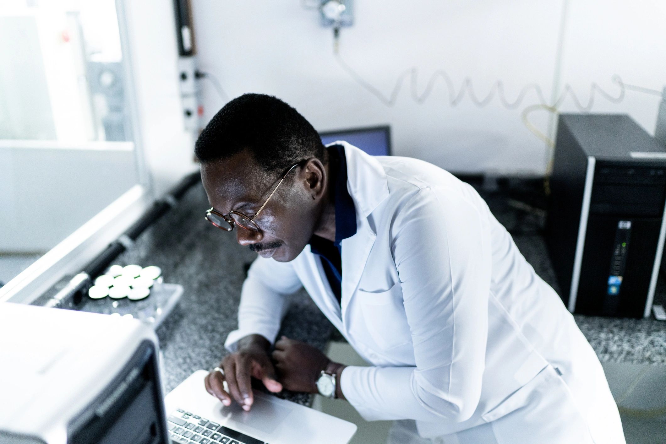 Scientist using computer in laboratory