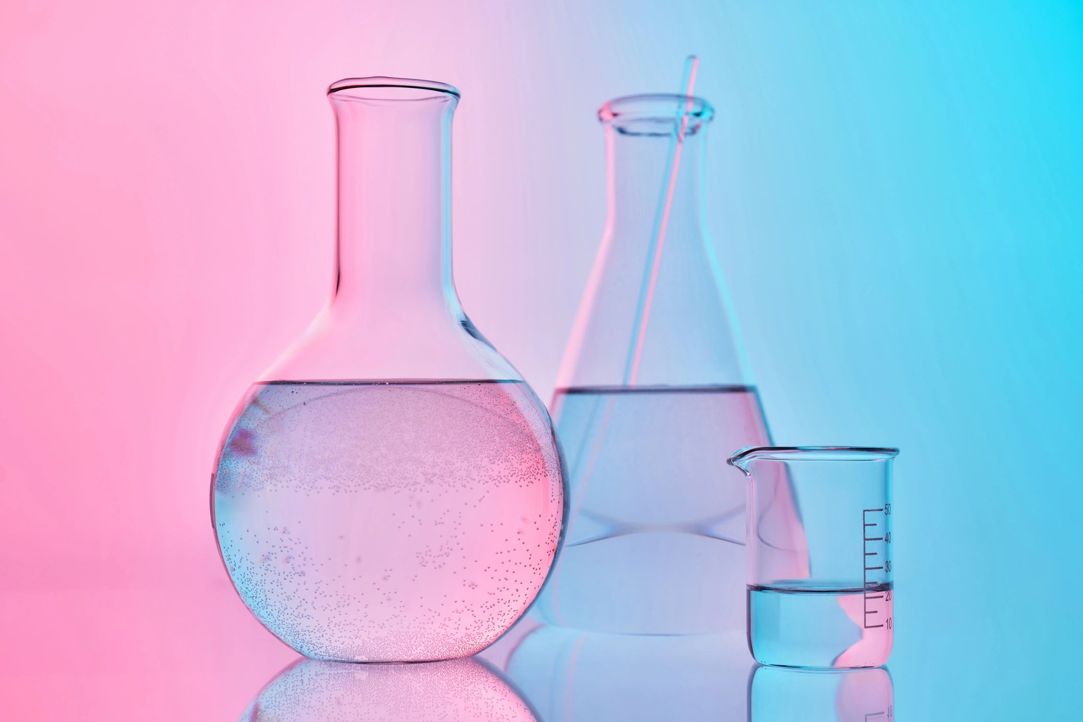 Laboratory glassware with colorful lighting representing analytical work